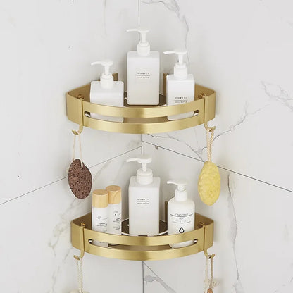 Gold corner shelf with bathroom products against a white tiled wall