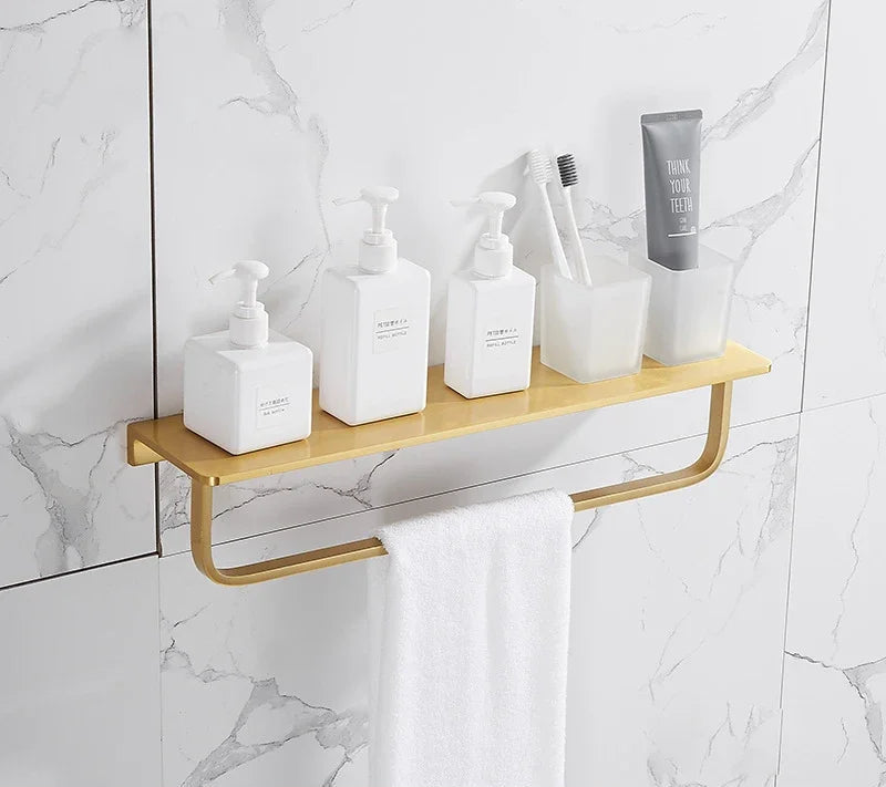 Wooden shelf with bathroom products against a marble wall