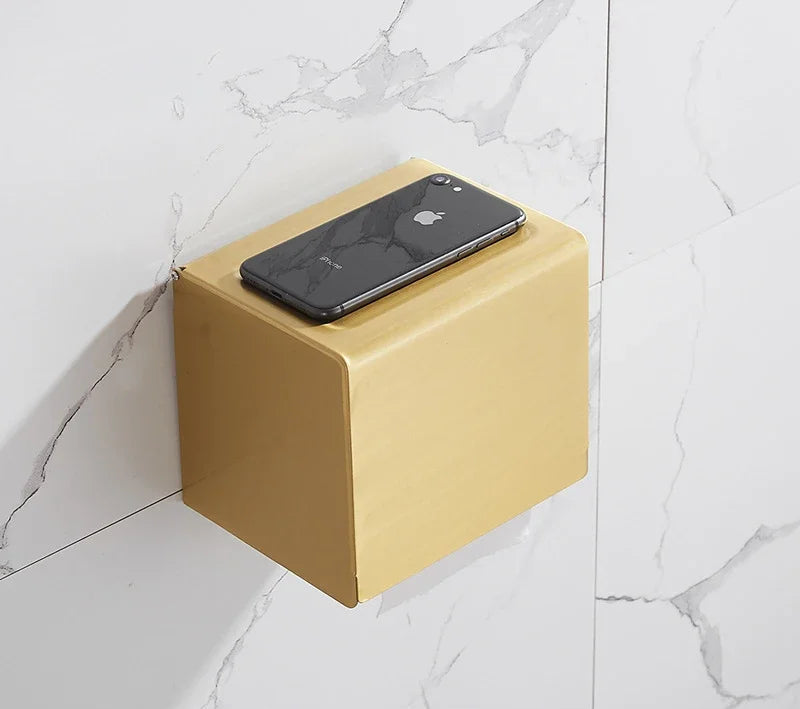 Yellow square wall-mounted device with a phone on top against a marble wall.