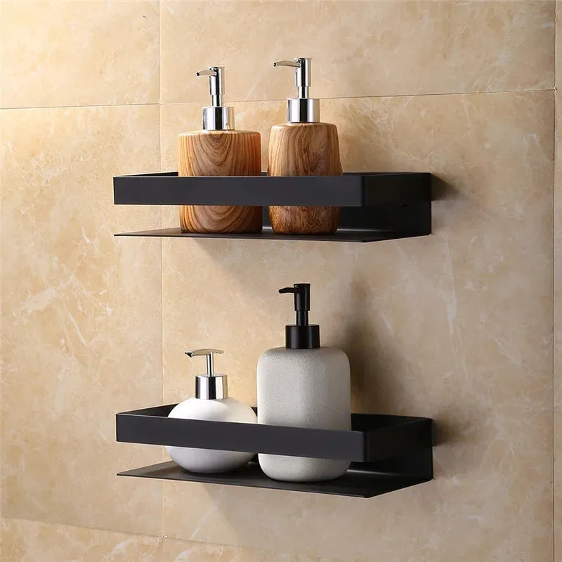 Bathroom shelves with soap dispensers against a beige tiled wall