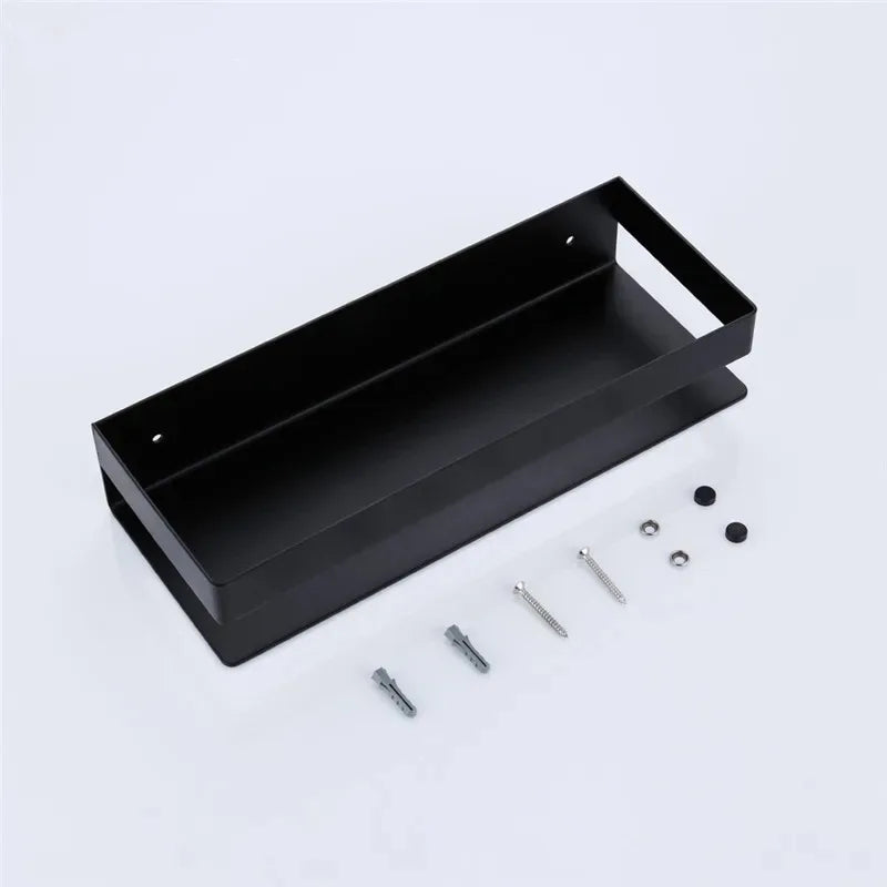 Black metal tray with screws on a light gray background