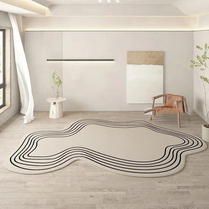 Modern room with a decorative rug featuring wavy black lines on a light wood floor.