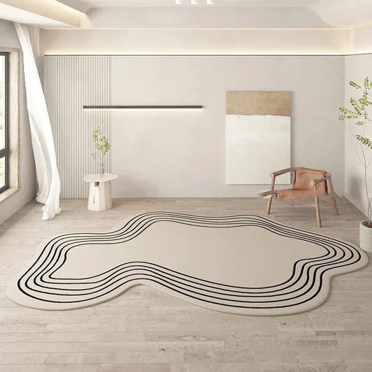 Modern room with a decorative rug featuring wavy black lines on a light wood floor.