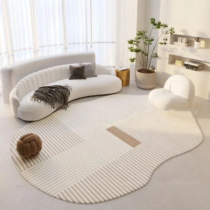 Modern living room with a curved white sofa, round rug, and decorative items.