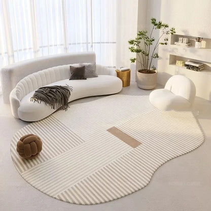 Modern living room with a curved white sofa, round rug, and decorative items.