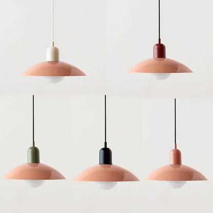 Set of five pendant lights with pink and gold bases on a white background