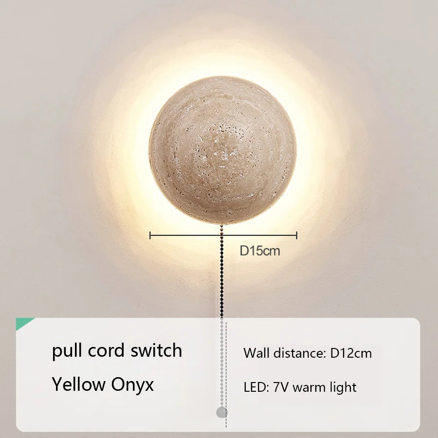 Wall-mounted round light fixture with dimensions and feature details on a neutral background