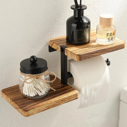 Wooden shelf with bathroom items including a jar, bottle, and roll of toilet paper on a light background.