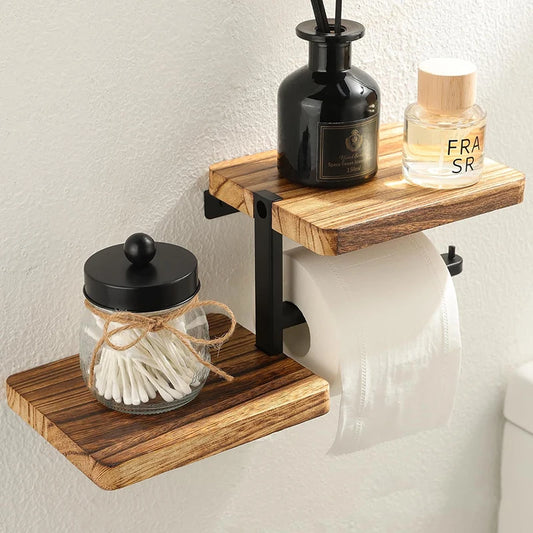 Wooden shelf with bathroom items including a jar, bottle, and roll of toilet paper on a light background.