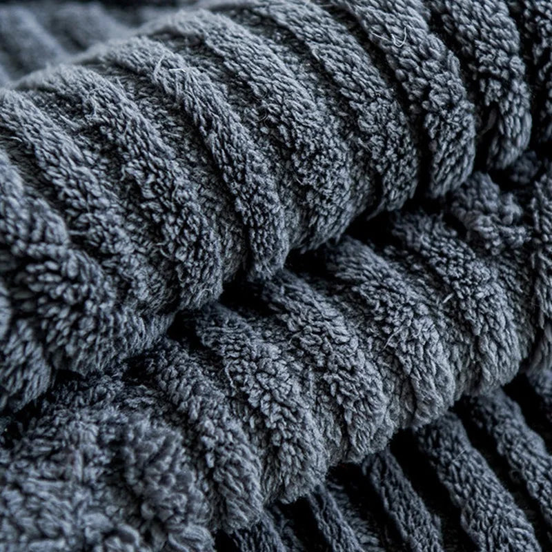 Stack of dark gray textured towels
