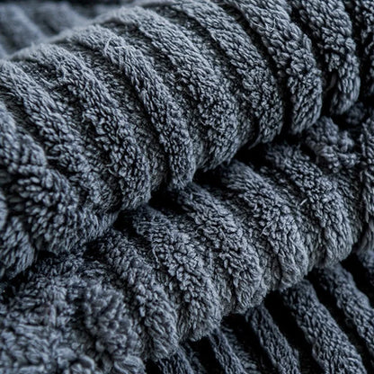 Stack of dark gray textured towels